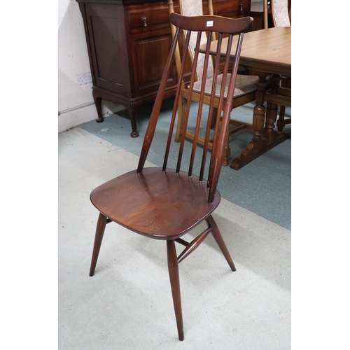 100 - A mid 20th century Ercol stained elm and beech Ercol dining table and six chairs, table with shaped ... 