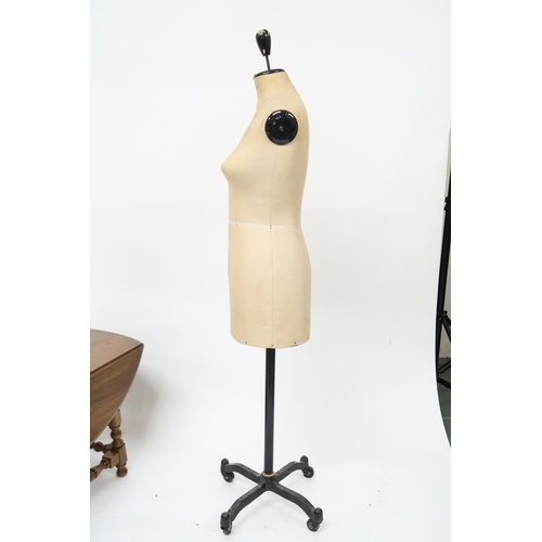 105 - A mid 20th century Stockman M & S 36 dressmakers mannequin on cast iron quadrupedal base with ca... 