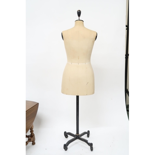 105 - A mid 20th century Stockman M & S 36 dressmakers mannequin on cast iron quadrupedal base with ca... 