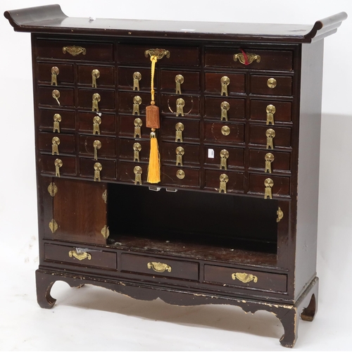 109 - A 20th century Oriental hardwood altar style collectors chest with three long drawers over five rows... 