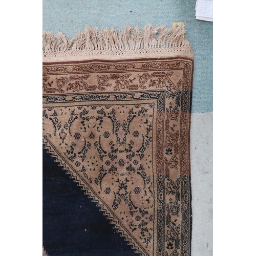 110 - A dark blue ground Sarouk rug with beige geometric central medallion, matching spandrels and geometr... 