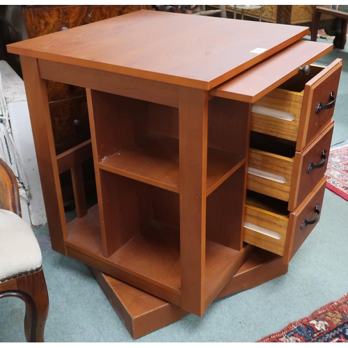 112 - A contemporary teak revolving bookcase, 60cm high x 48cm wide x 48cm deep