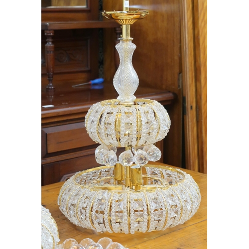 113 - A pair of contemporary gilt cut glass stepped chandeliers, 65cm high x 40cm diameter (2)