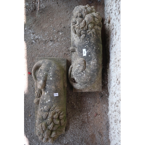 145 - A pair of 20th century stoneware garden statues of sleeping lions, 21cm high x 49cm long x 20cm deep... 