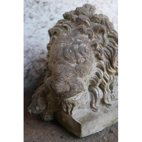 145 - A pair of 20th century stoneware garden statues of sleeping lions, 21cm high x 49cm long x 20cm deep... 