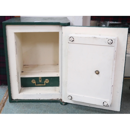 59 - A Victorian green painted cast iron safe with brass plaque and door knob on hinged door concealing o... 