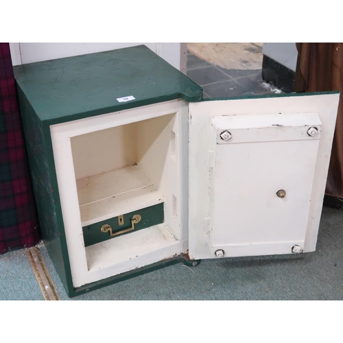 59 - A Victorian green painted cast iron safe with brass plaque and door knob on hinged door concealing o... 