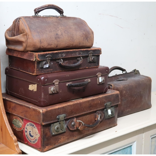 65 - A mixed lot comprising three leather suitcases and two assorted Gladstone style bags (5)