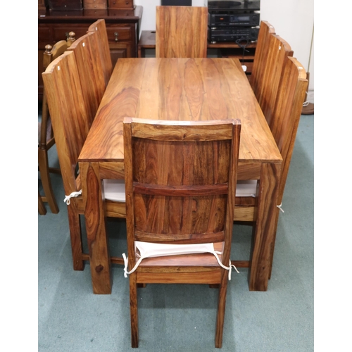 90 - A contemporary mangowood dining table and eight chairs, table with square supports, 76cm high x 175c... 