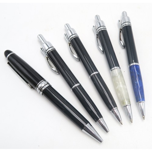 565 - A collection of Mont Blanc ballpoint pens, including Hemingway examples