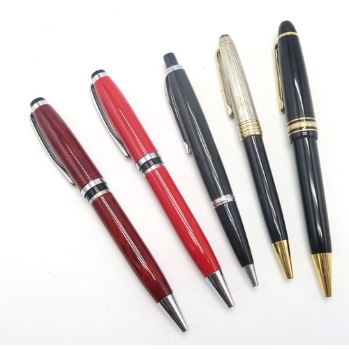 565 - A collection of Mont Blanc ballpoint pens, including Hemingway examples