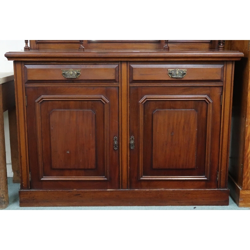 18 - A late Victorian mahogany mirror back sideboard with carved surmount over bevelled mirror panes on b... 