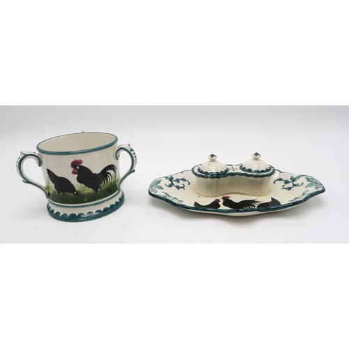 208 - A Wemyss ware black cockerel and hens double inkwell26cm wide, together with a tyg, 10cm high (2)... 