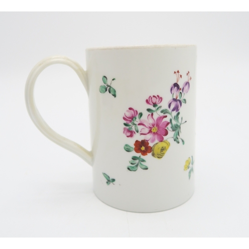 217 - An 18th century Plymouth mug, circa 1770, painted with bouquets of flowers, 11.8cm high