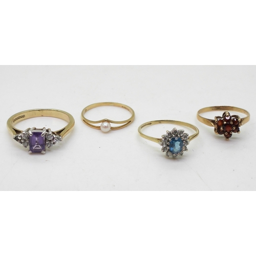 724 - Four 9ct gold rings, amethyst and cz size N, blue topaz and cz, size M1/2, garnet size K1/2, and pea... 