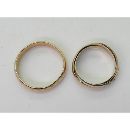 741 - A 9ct gold court wedding ring, size Y1/2, and a 9ct gold three colour gold Russian wedding ring set ... 