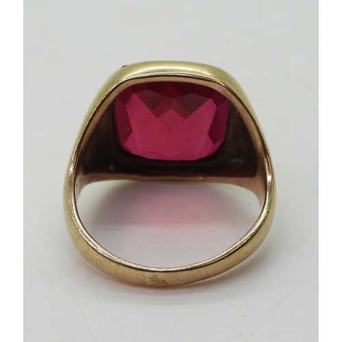 743 - A 9ct gold red glass gem set signet ring, size U approx, weight 9.6gms