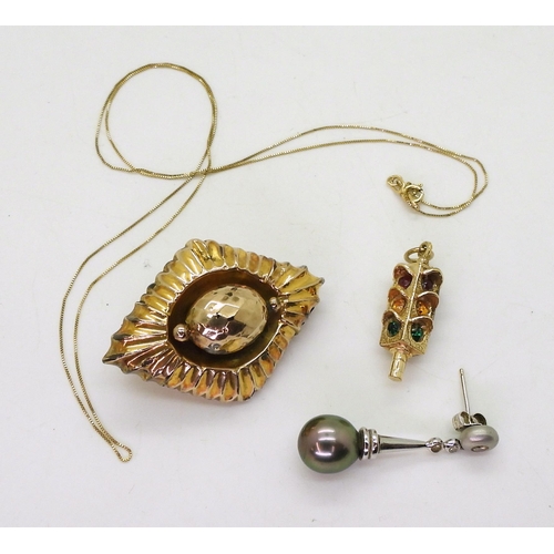 769 - A 9ct gold traffic lights pendant and chain, and a yellow metal locket back brooch, weight 9.8gms, a... 