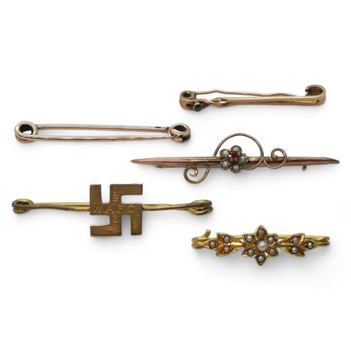 776 - Five gold and yellow metal brooches to include a 14ct gold Swastika brooch weight 2.2gms, and the we... 