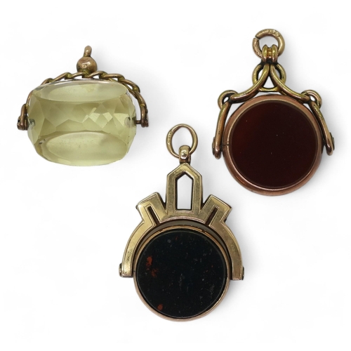 779 - Three 9ct gold mounted fob seals, two set with bloodstone and carnelian and another in citrine, weig... 