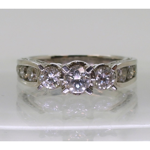 782 - An 18ct white gold diamond ring, with 1.50cts of brilliant cut diamonds set to the bezel, shoulders ... 