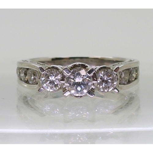 782 - An 18ct white gold diamond ring, with 1.50cts of brilliant cut diamonds set to the bezel, shoulders ... 