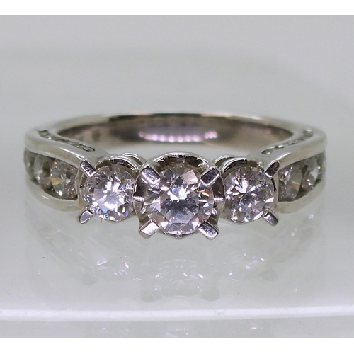 782 - An 18ct white gold diamond ring, with 1.50cts of brilliant cut diamonds set to the bezel, shoulders ... 