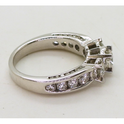 782 - An 18ct white gold diamond ring, with 1.50cts of brilliant cut diamonds set to the bezel, shoulders ... 