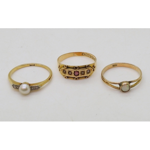 787 - three gold rings, an 18ct gold pearl and diamond ring, size N1/2 1.9gms, 15ct pearl and red gem, siz... 