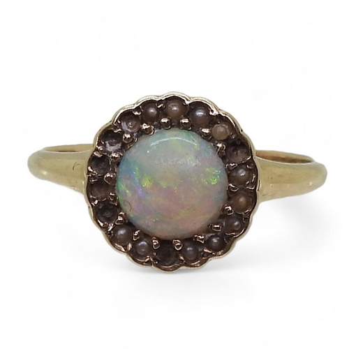 789 - A bright yellow metal ring set with an opal and split pearls (some losses) size O1/2, weight 2.3gms