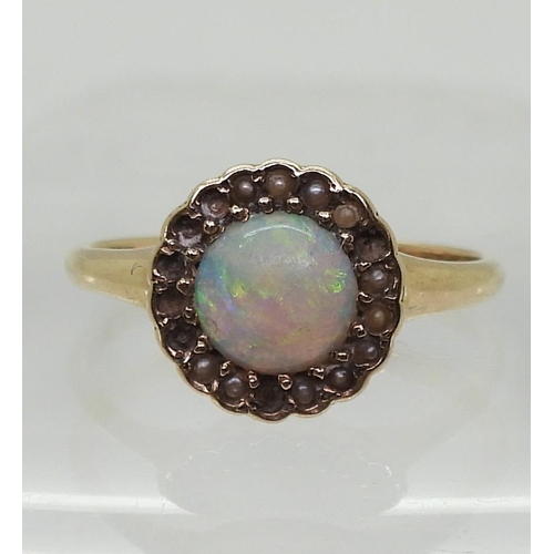 789 - A bright yellow metal ring set with an opal and split pearls (some losses) size O1/2, weight 2.3gms