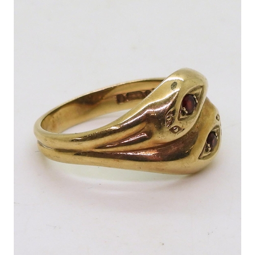 797 - A 9ct gold snake ring the heads set with garnets, hallmarked London 1968, size V1/2, weight 5.9gms