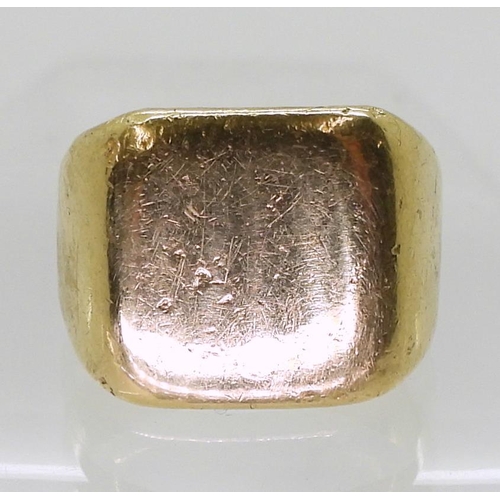 808 - A bright yellow metal signet ring, size R, weight 16.6gms