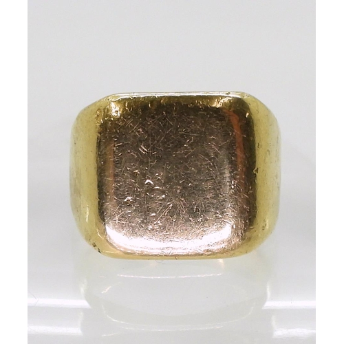 808 - A bright yellow metal signet ring, size R, weight 16.6gms