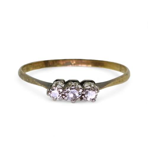 811 - An 18ct gold and platinum three stone diamond ring, set with estimated approx 0.10cts of eight cut d... 