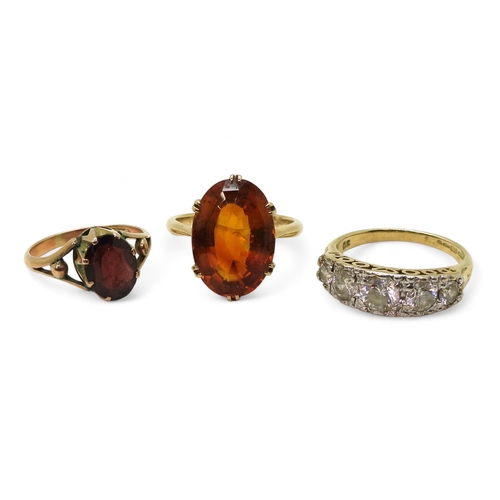 818 - Three gem set rings, to include a 9ct gold citrine ring, size K1/2, a 9ct gold garnet ring, size H1/... 