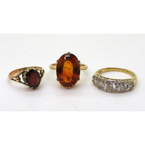 818 - Three gem set rings, to include a 9ct gold citrine ring, size K1/2, a 9ct gold garnet ring, size H1/... 