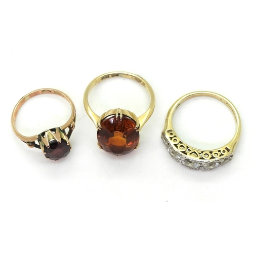 818 - Three gem set rings, to include a 9ct gold citrine ring, size K1/2, a 9ct gold garnet ring, size H1/... 