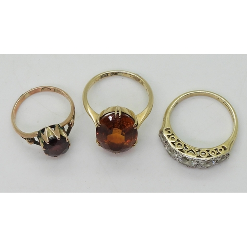 818 - Three gem set rings, to include a 9ct gold citrine ring, size K1/2, a 9ct gold garnet ring, size H1/... 