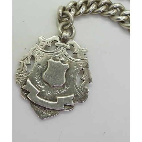 846 - A heavy silver tapered fob chain with silver medallion, hallmarked to every link, tapers from 12.1mm... 