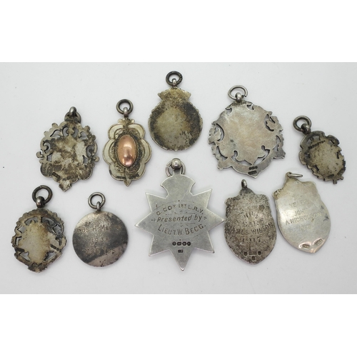 848 - Various silver award medallions to include a Scots Guard example dated 1889, A further enamelled Roy... 