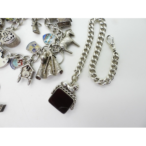 849 - Two silver and white metal charm bracelets together with a silver fob chain bracelet with attached s... 