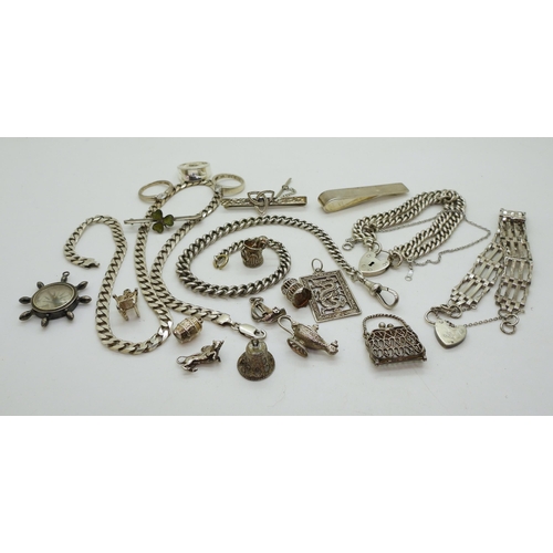 856 - A collection of silver and white metal to include curb chain bracelets and a necklace, gate bracelet... 