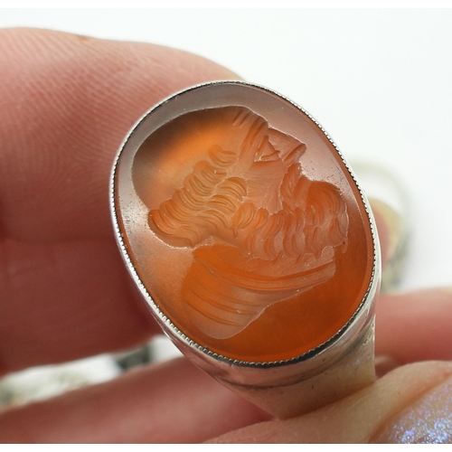 859 - A silver ring with 1969 London hallmarks set with a carved  carnelian intaglio of a Gentleman, a sil... 