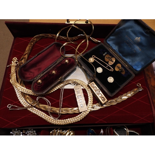 868 - A red velvet jewellery box full of vintage costume to include, vintage gold plated studs in boxes, t... 