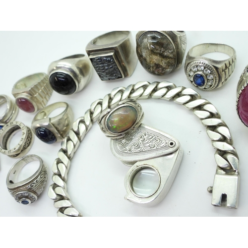 880 - A collection of silver and white metal, a curb chain bracelet, gem set rings to include man made opa... 