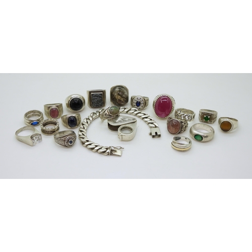 880 - A collection of silver and white metal, a curb chain bracelet, gem set rings to include man made opa... 