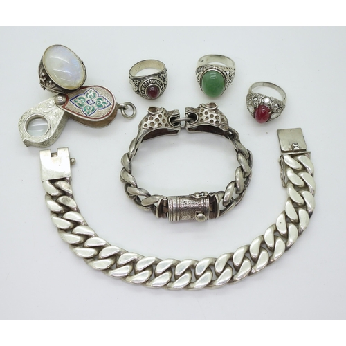 881 - A white metal curb chain bracelet with leopard's head finials, a further example both stamped 925, a... 