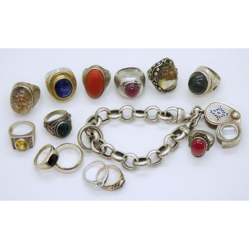 882 - A collection of silver and white metal rings, to include treated sapphire, quartz and a white metal ... 