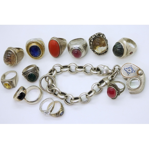 882 - A collection of silver and white metal rings, to include treated sapphire, quartz and a white metal ... 